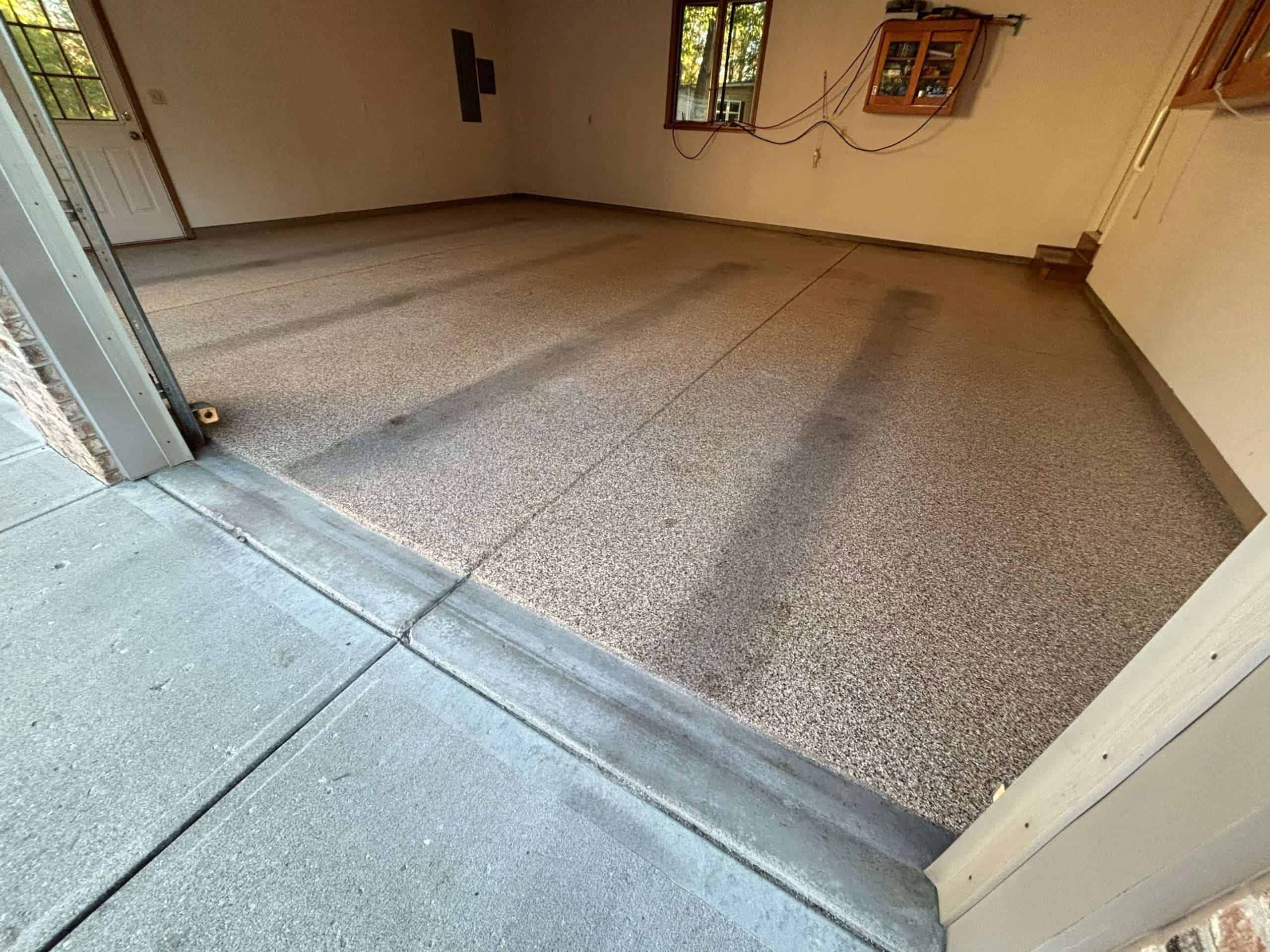 garage floor that had epoxy coating on it
