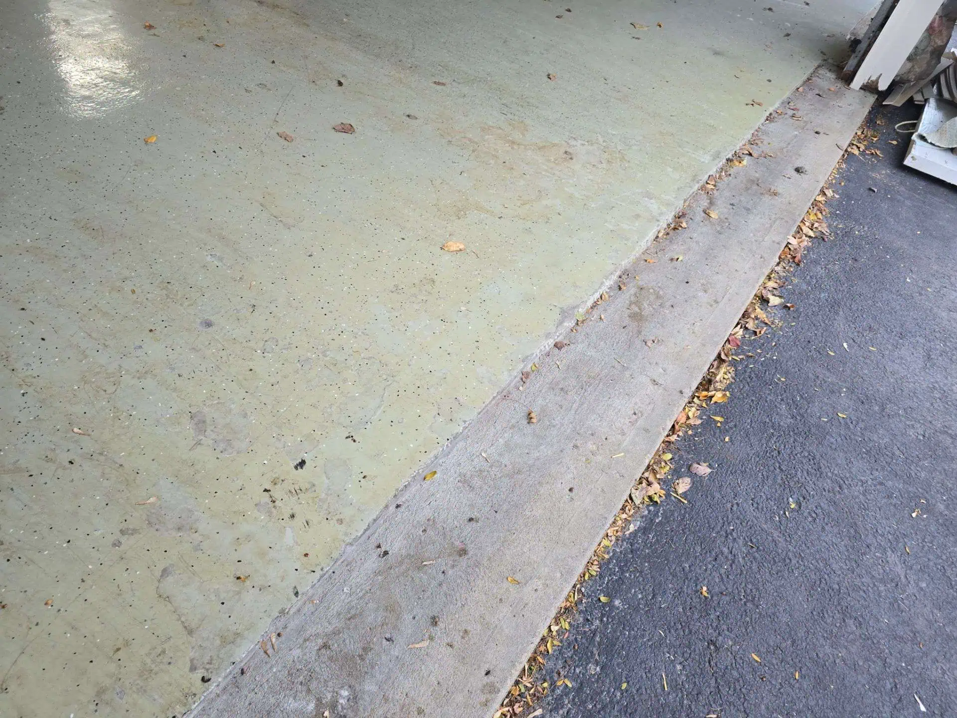 garage floor that had epoxy coating on it